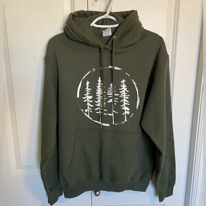 Dark green hoodie with tree graphic